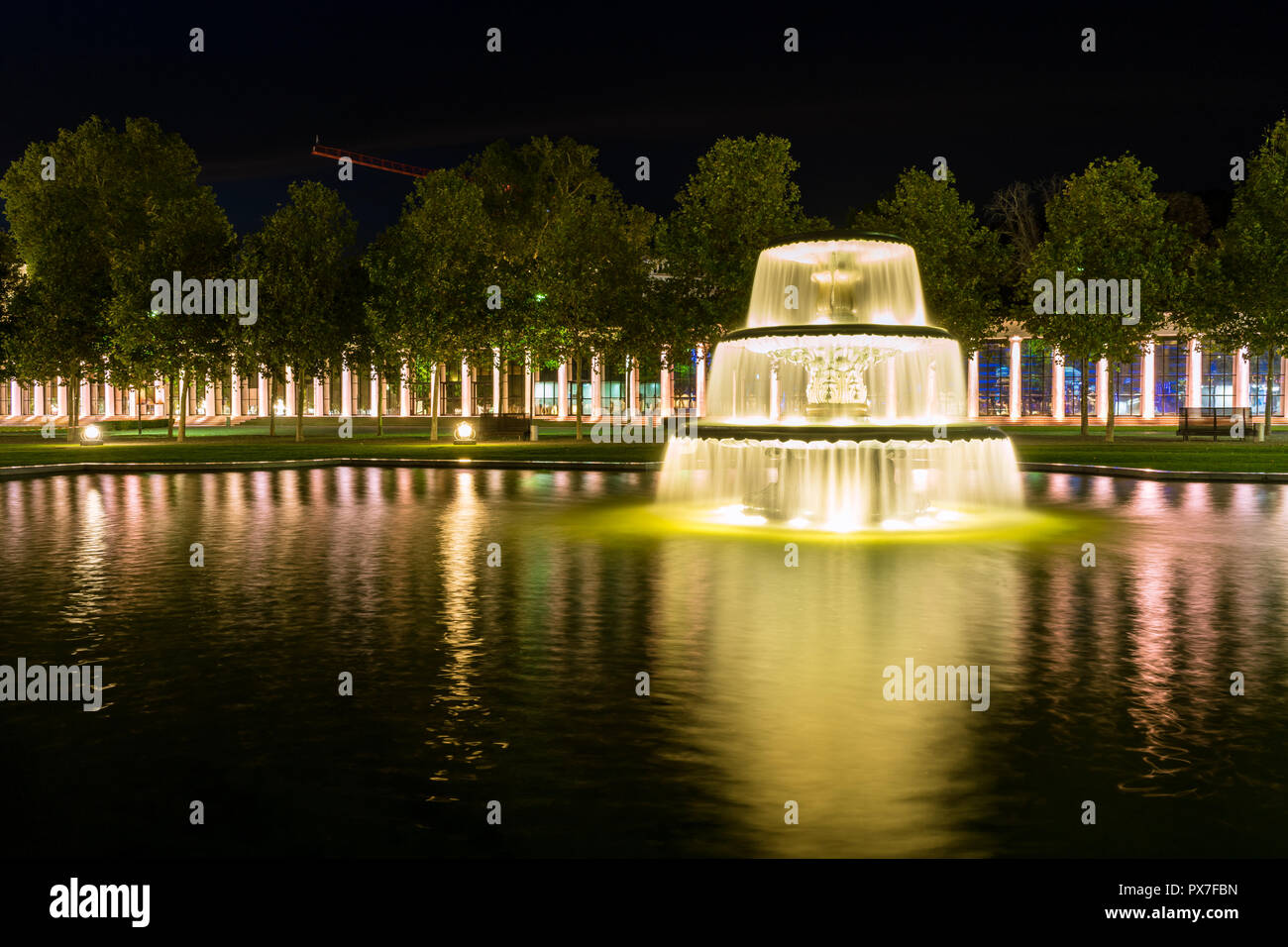 Germany, City of Wiesbaden fountain in park in the night Stock Photo