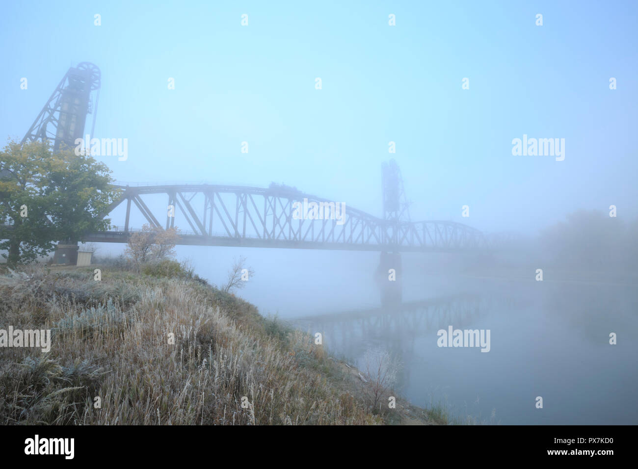 old snowden railroad bridge in fog over the missouri river near nohly, montana Stock Photo