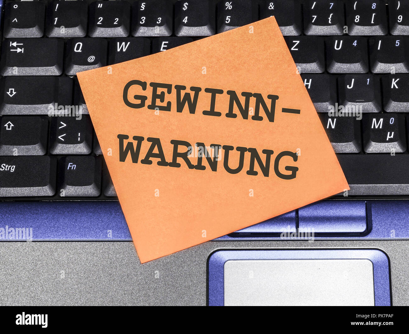 Notes As Warning Memo note on notebook, profit warning Stock Photo - Alamy