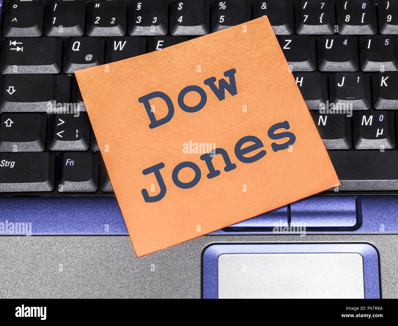 Memo note on notebook, Dow Jones Stock Photo