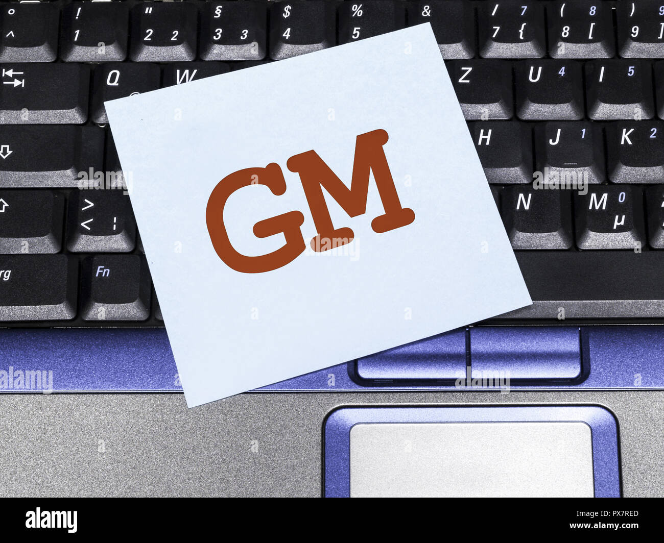 Memo note on notebook, GM, General Motors Stock Photo - Alamy
