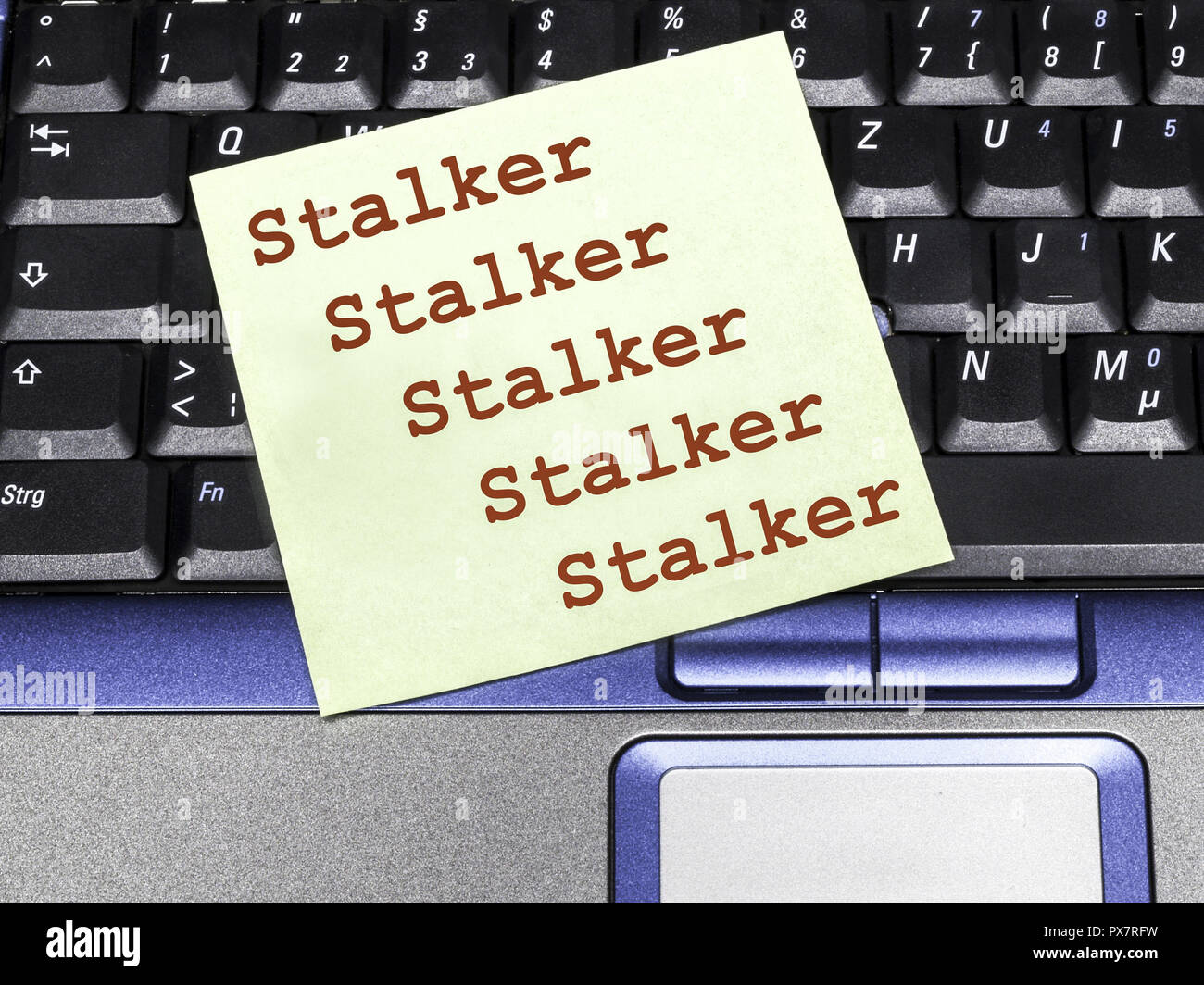 Memo note on notebook, stalker Stock Photo - Alamy