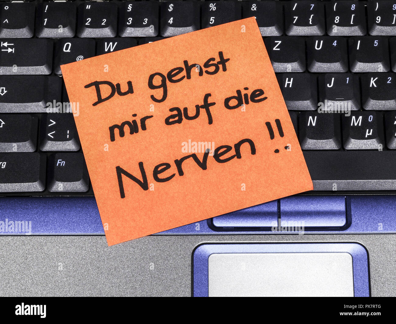 Memo note on notebook, Du gehst mir auf die Nerven you are on my nerves Stock Photo