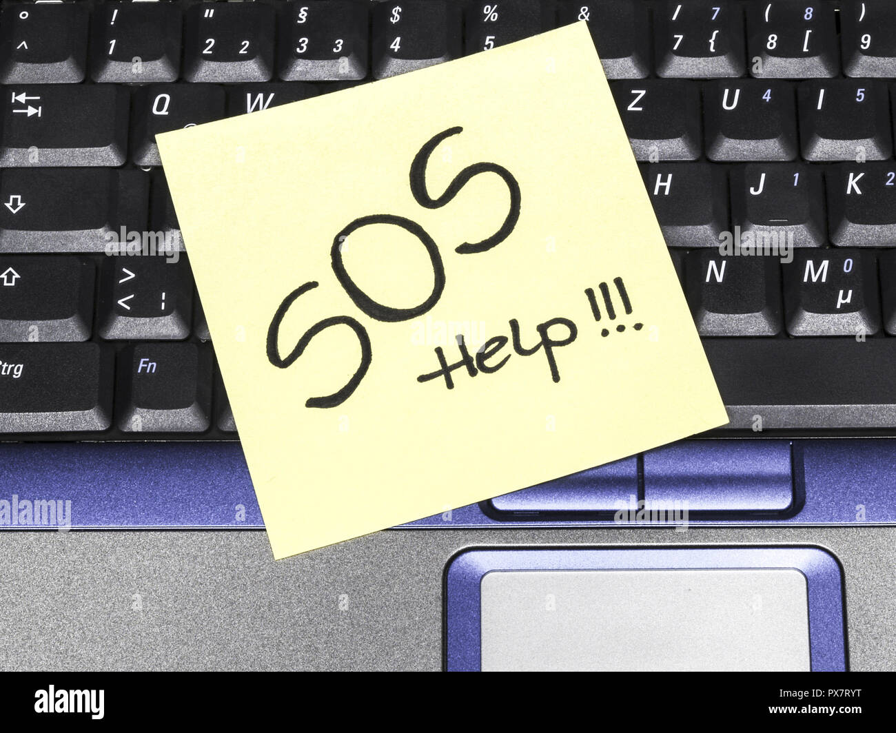Memo note on notebook, SOS help Stock Photo - Alamy