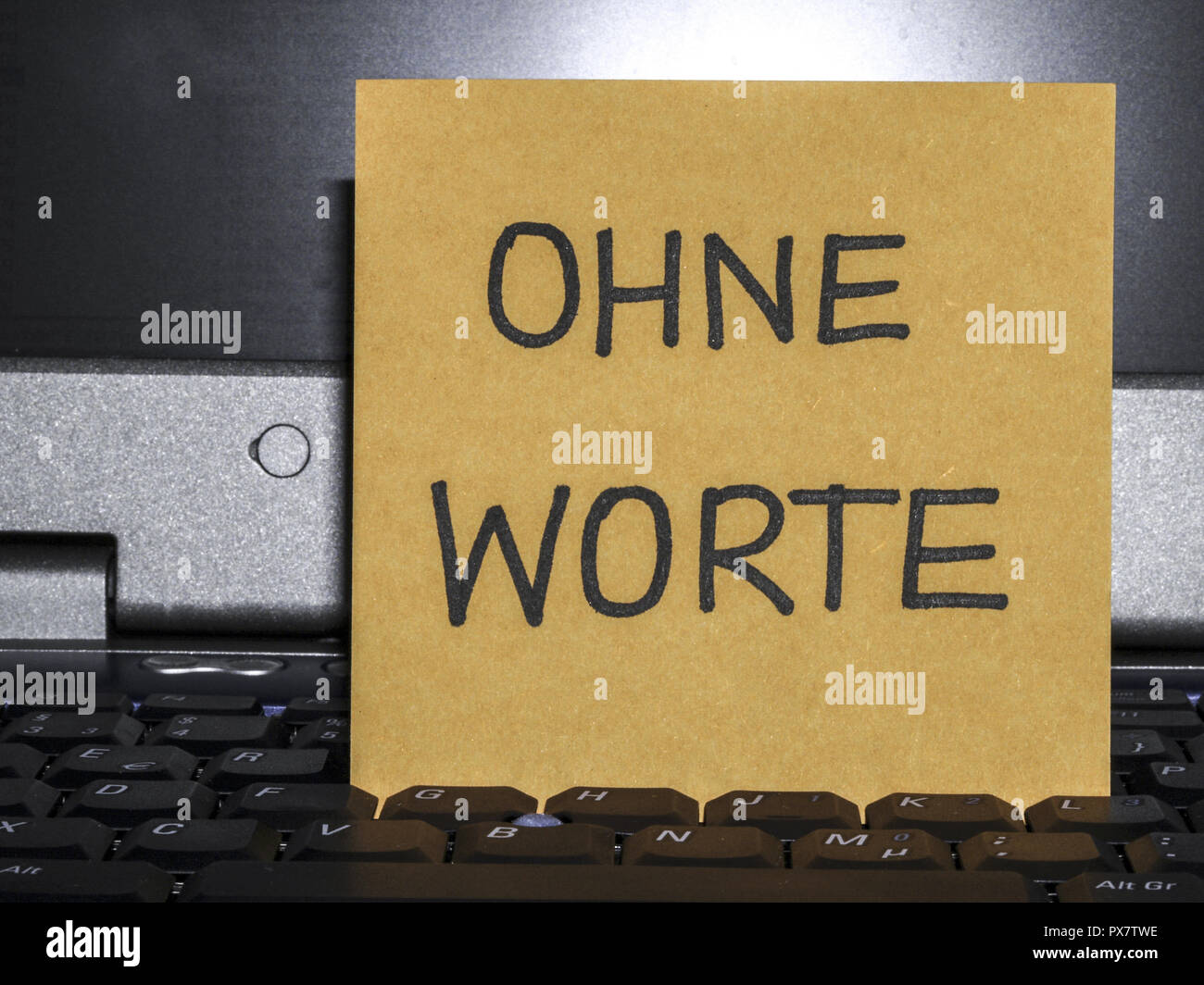 Memo note on notebook, Ohne Worte, without words Stock Photo