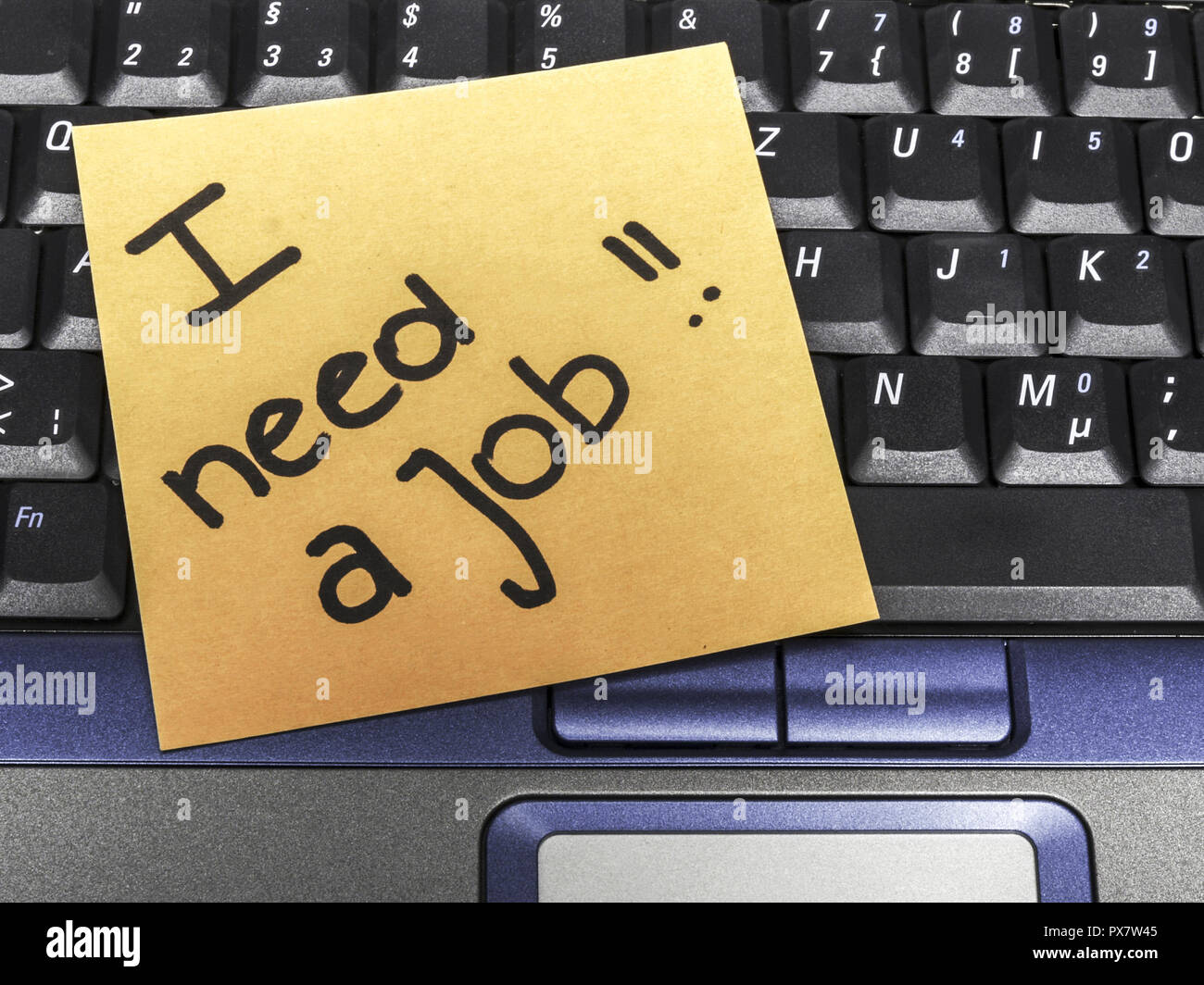 Memo note on notebook, I need a job Stock Photo