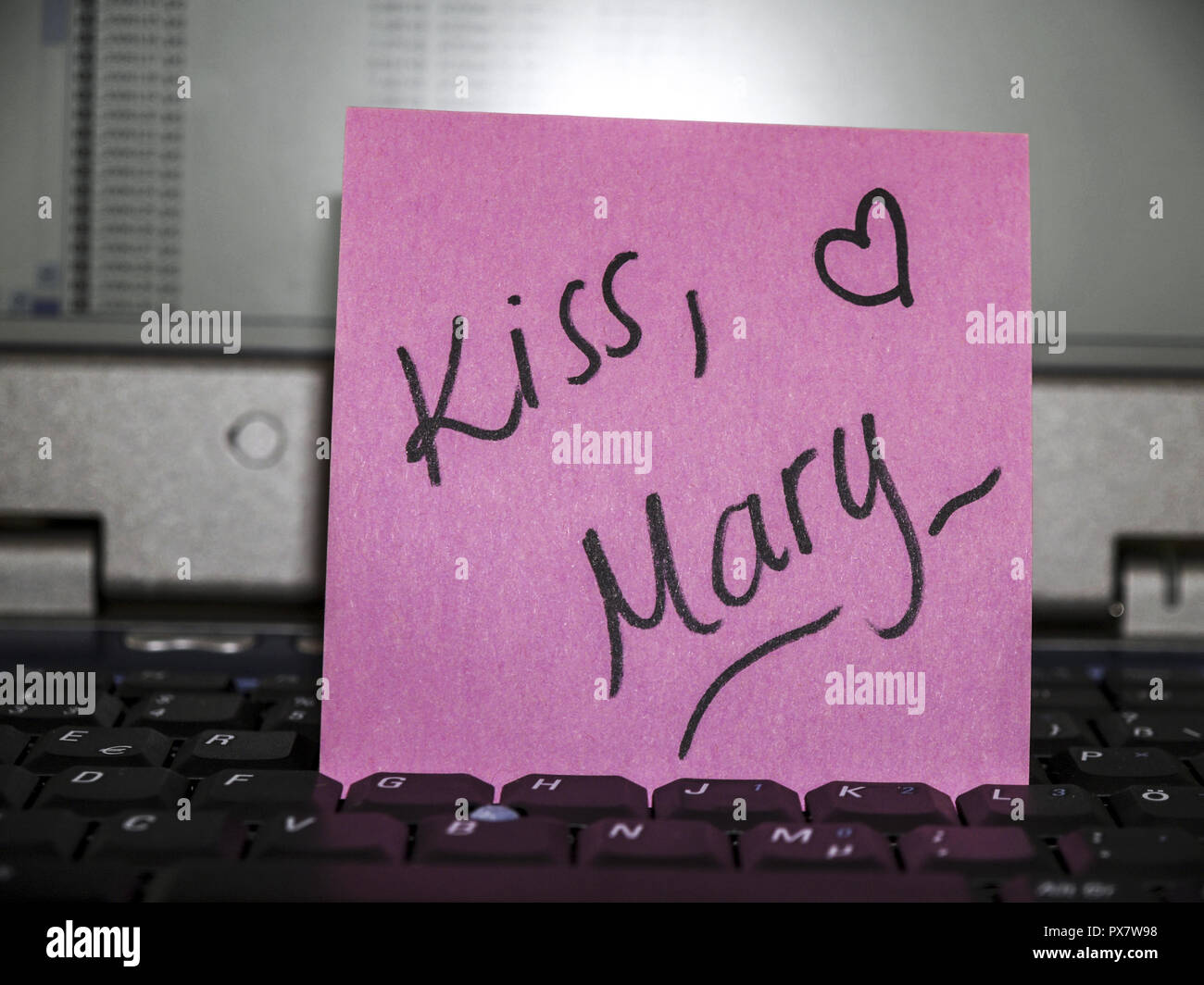 Memo note on notebook, kiss, Mary Stock Photo Alamy