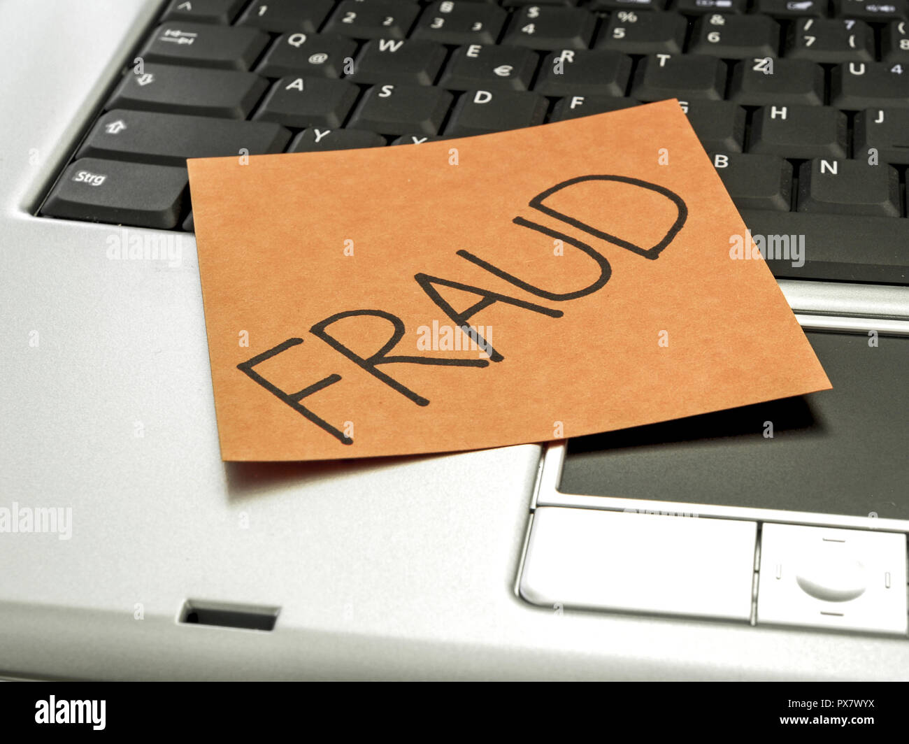 Memo note on notebook, fraud Stock Photo - Alamy