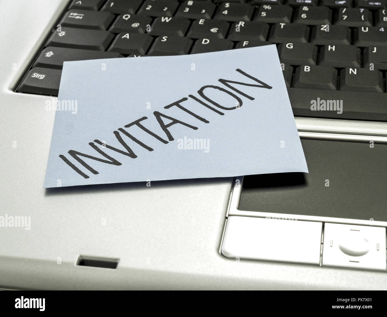 Memo note on notebook, invitation Stock Photo - Alamy