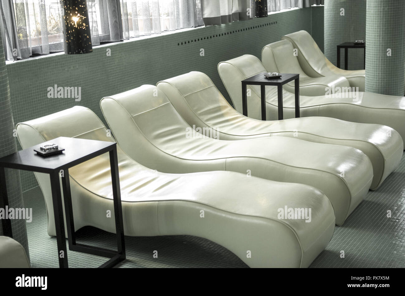 Room with white deck chairs Stock Photo - Alamy