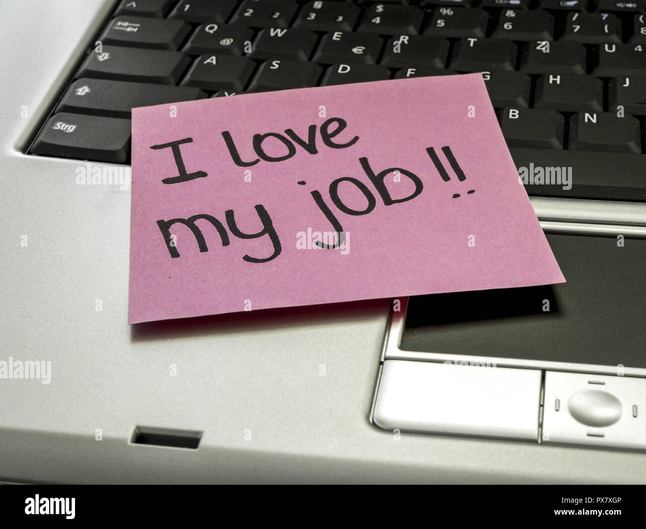Memo note on notebook, I love my job Stock Photo - Alamy