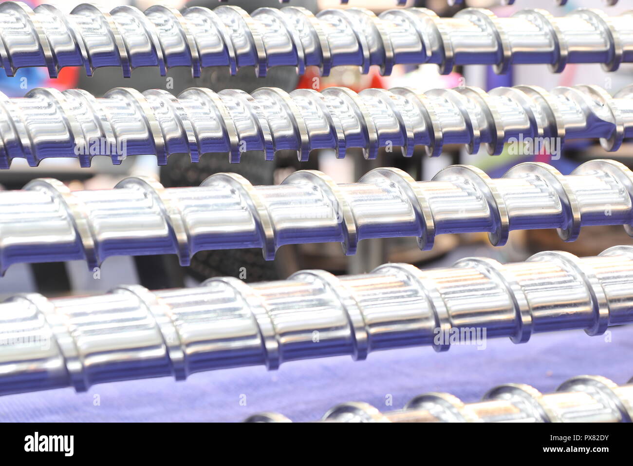 Screw press parts for plastic injection machine ; selective focus Stock Photo
