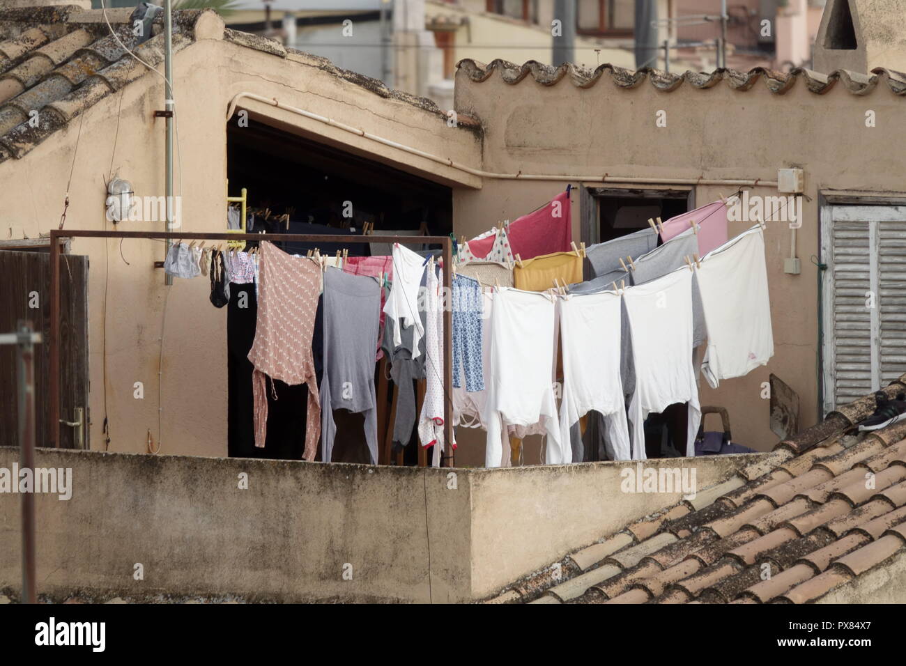 Drying laundry on Clothesline Clothes Roof Terrace Old Town Palma de Mallorca Spain Rooftop House Drying clothes Laundry Rooftops Laundry hanging Stock Photo