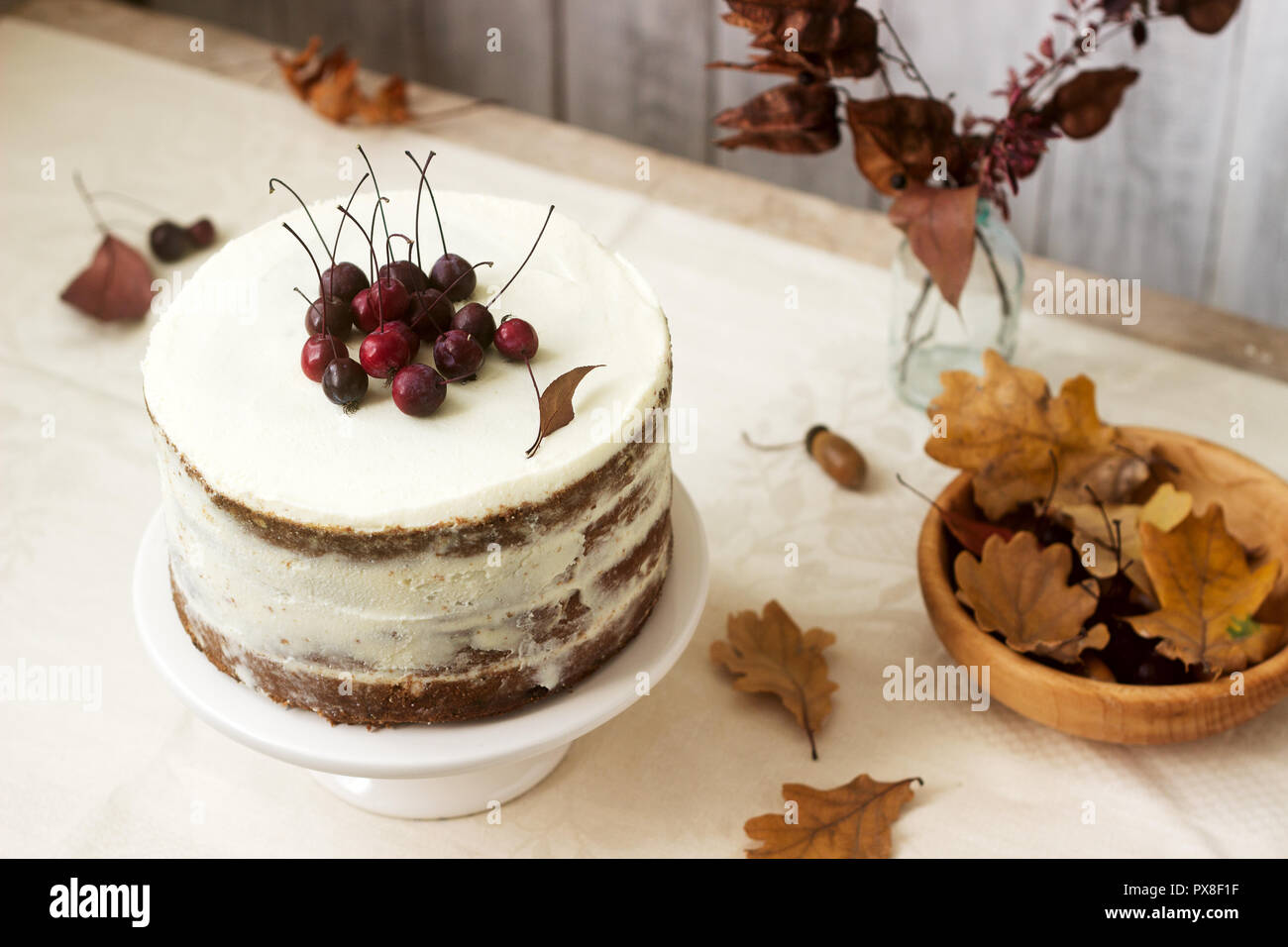 Apple Cake With Cream Decorated With Small Apples Against The