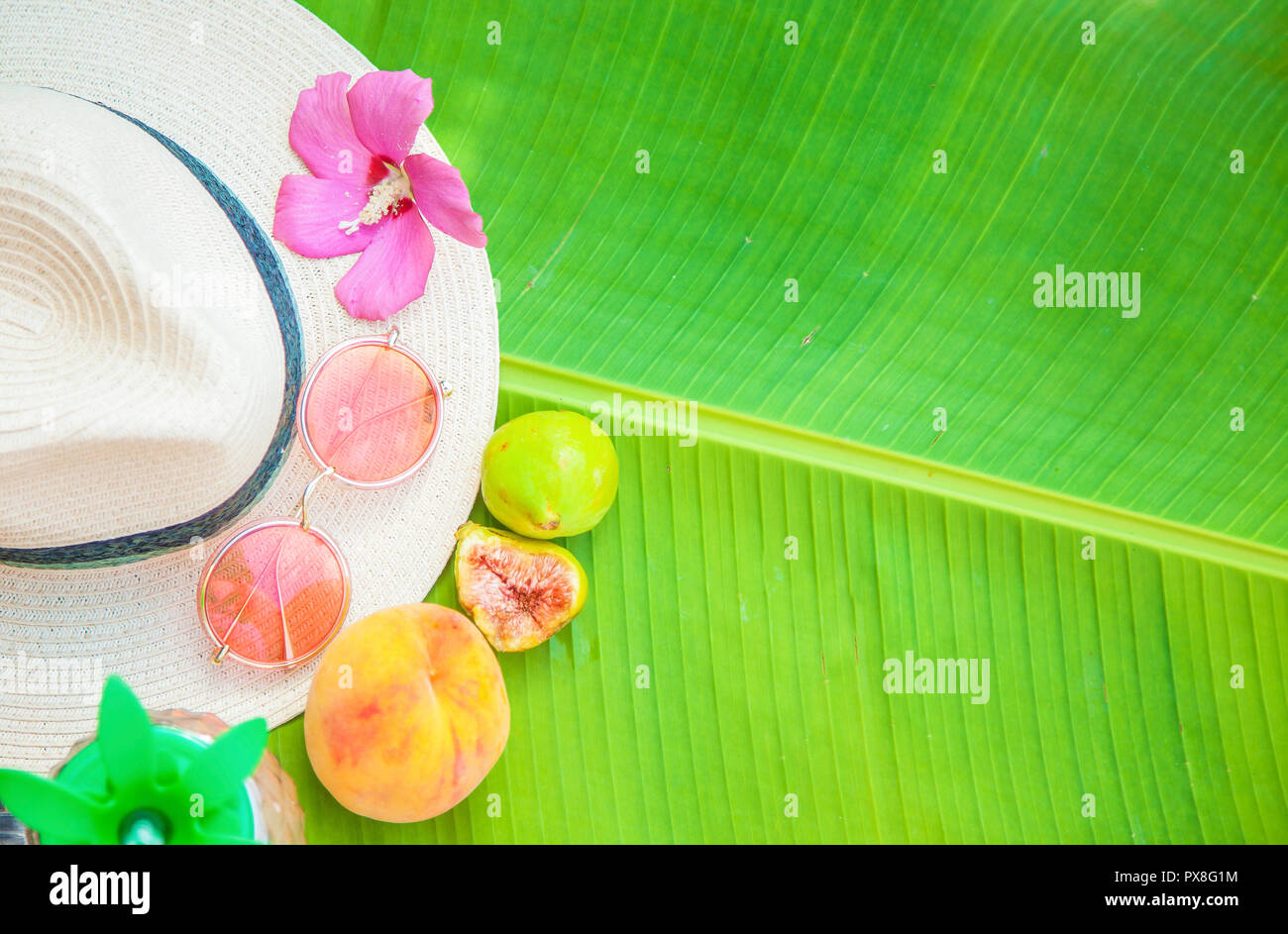 Palm leaf Straw hat Pink sunglasses Fruit Summer background Copy space ...