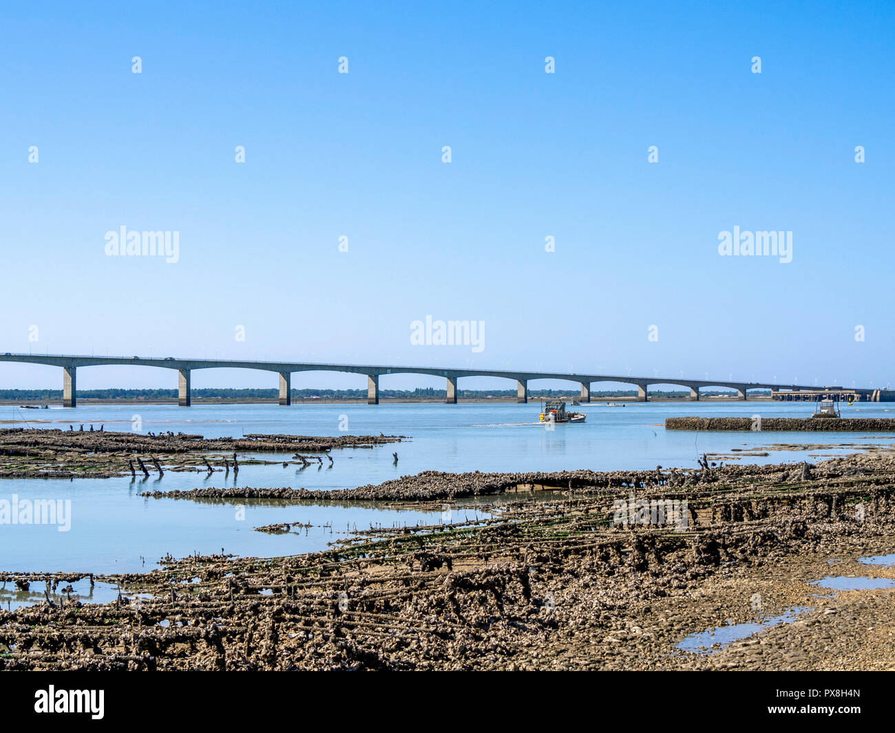 Oyster boat and Oleron bridge,  Charente Maritime, Nouvelle-Aquitaine, France Stock Photo