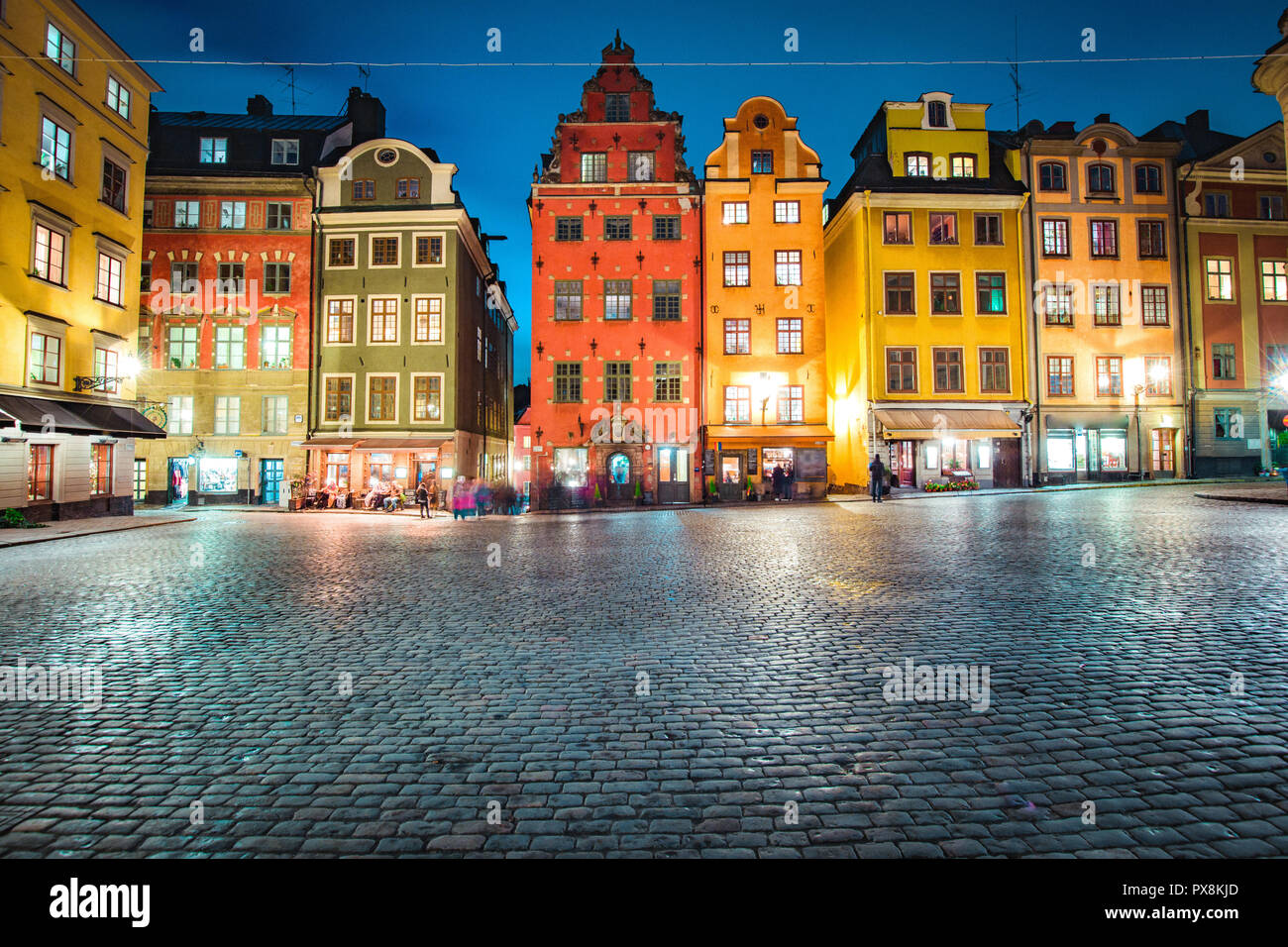 Classic view of colorful houses at famous Stortorget town square in Stockholm's historic Gamla Stan (Old Town) at night, central Stockholm, Sweden Stock Photo