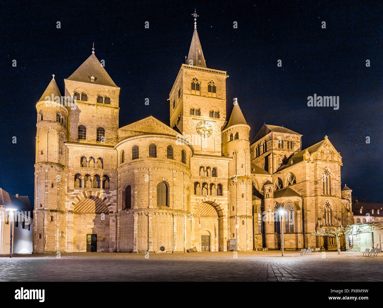 Beautiful view of famous Trierer Dom (High Cathedral of Trier) illuminated at night, Trier, Germany Stock Photo