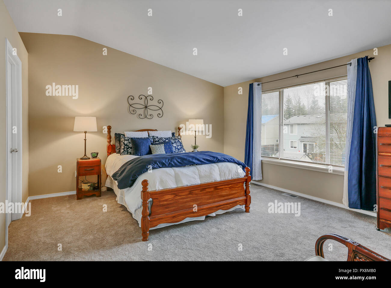 Master Bedroom Interior With Warm Yellow Tones And Blue Curtains Stock Photo Alamy Master Bedroom Interior With Warm Yellow Tones And Blue Curtains Stock Photo Alamy