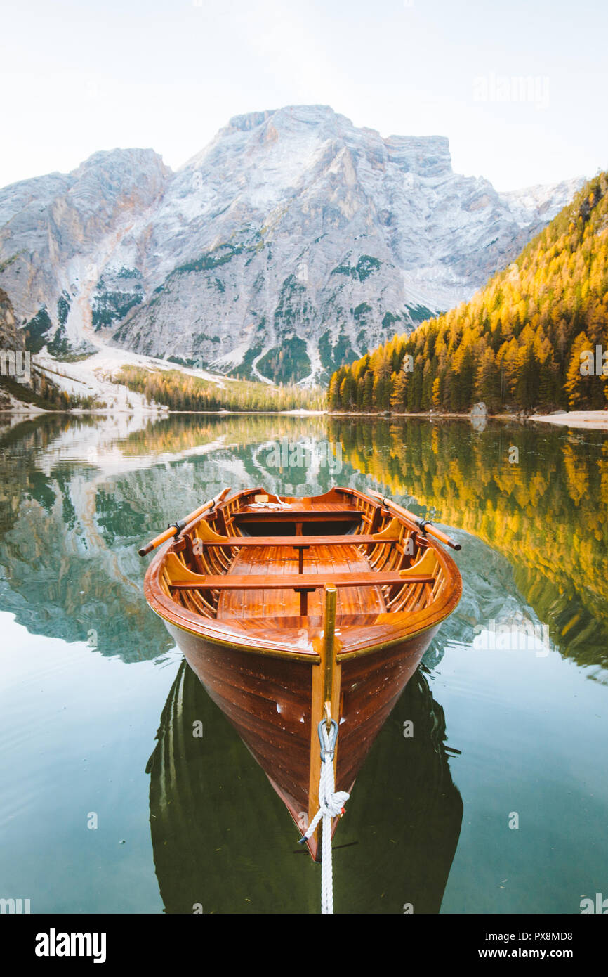 Beautiful view of traditional wooden rowing boat on scenic Lago di Braies in the Dolomites in scenic morning light at sunrise, South Tyrol, Italy Stock Photo