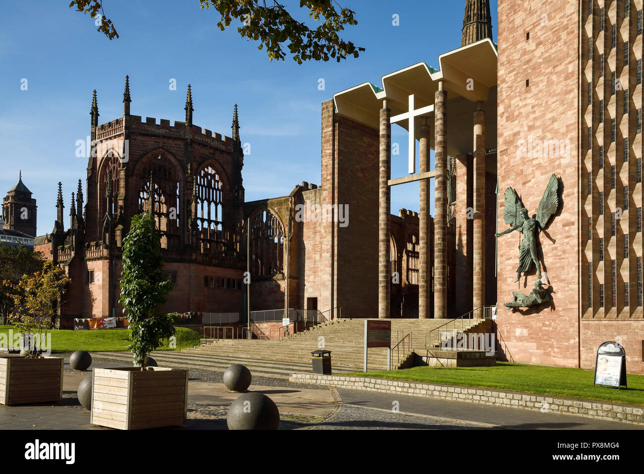 The old ruins and new Coventry Cathedral viewed from University Square on Priory Street in Coventry city centre UK Stock Photo