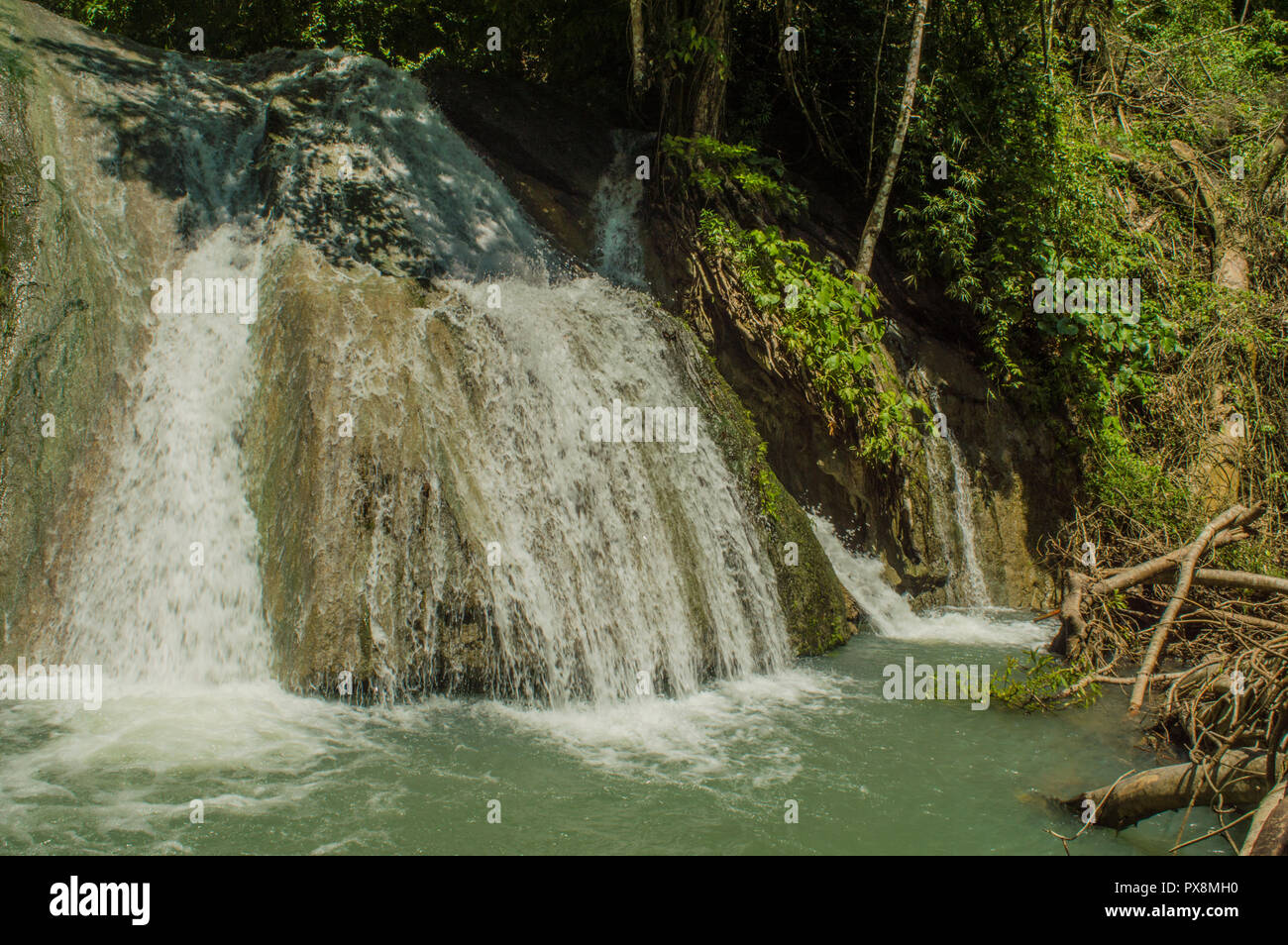 Watu Ondo waterfalll is locating in Ambulu village, South Jember, Jember regency. The water is green and looking beautiful. Stock Photo