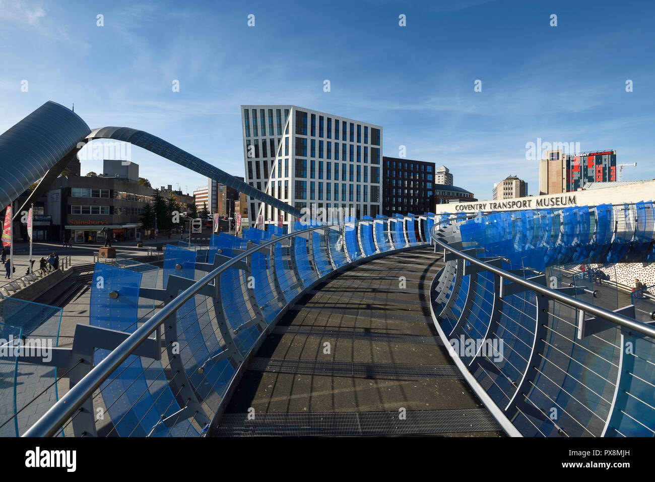 The pedestrian Glass Bridge adjacent to the Coventry Transport Museum in the city centre UK Stock Photo