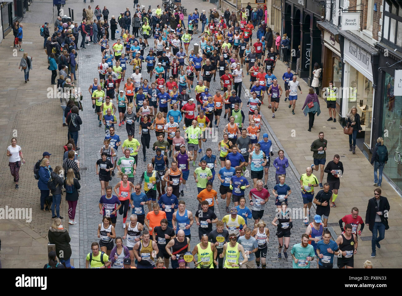 Chester, UK. Runners taking part in the 2018 Chester Marathon pass city