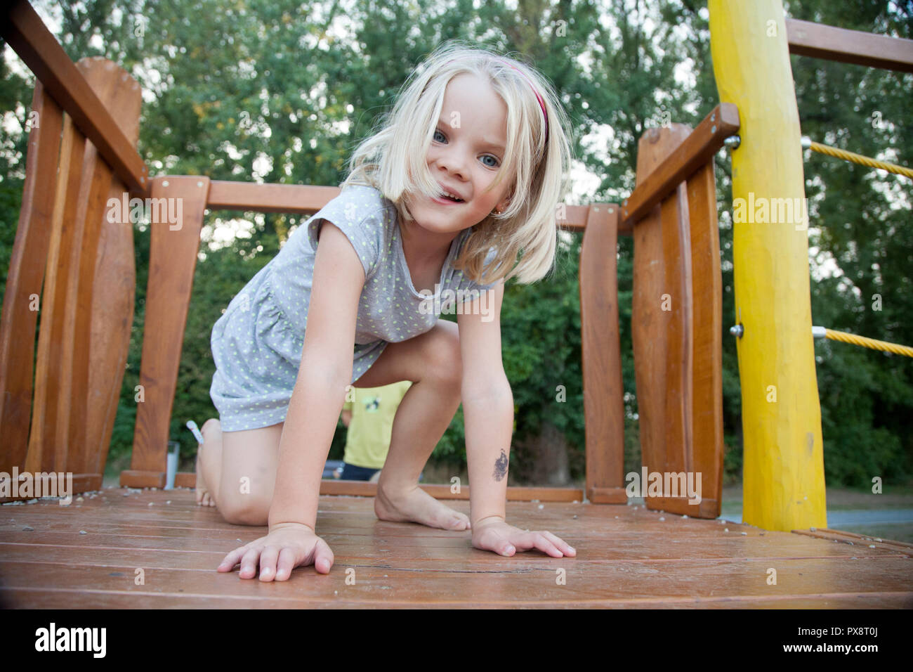 1. Cute little girl with blond hair playing in the park - wide 10