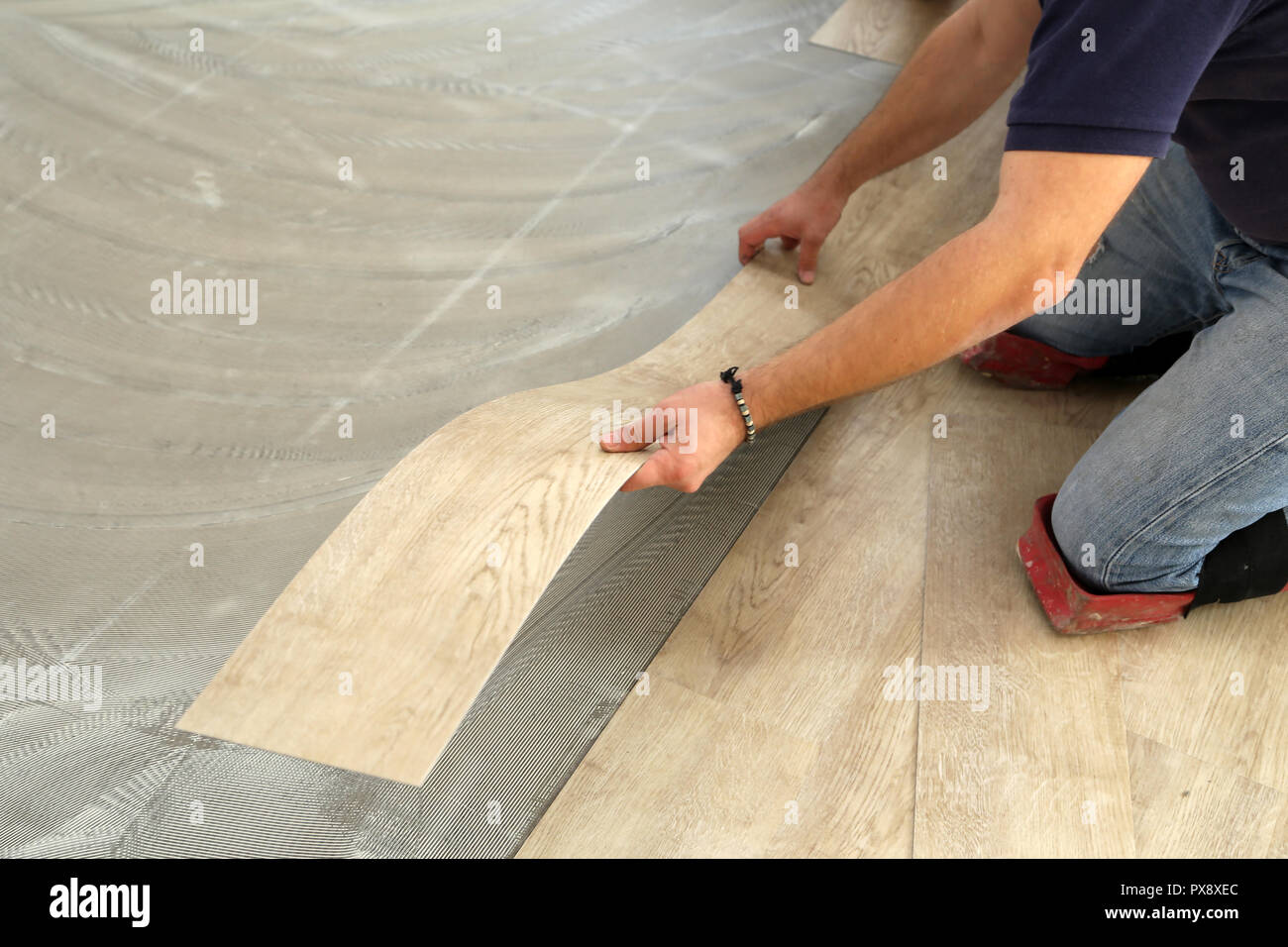 Worker Installing New Vinyl Tile Floor Stock Photo 222701876 Alamy