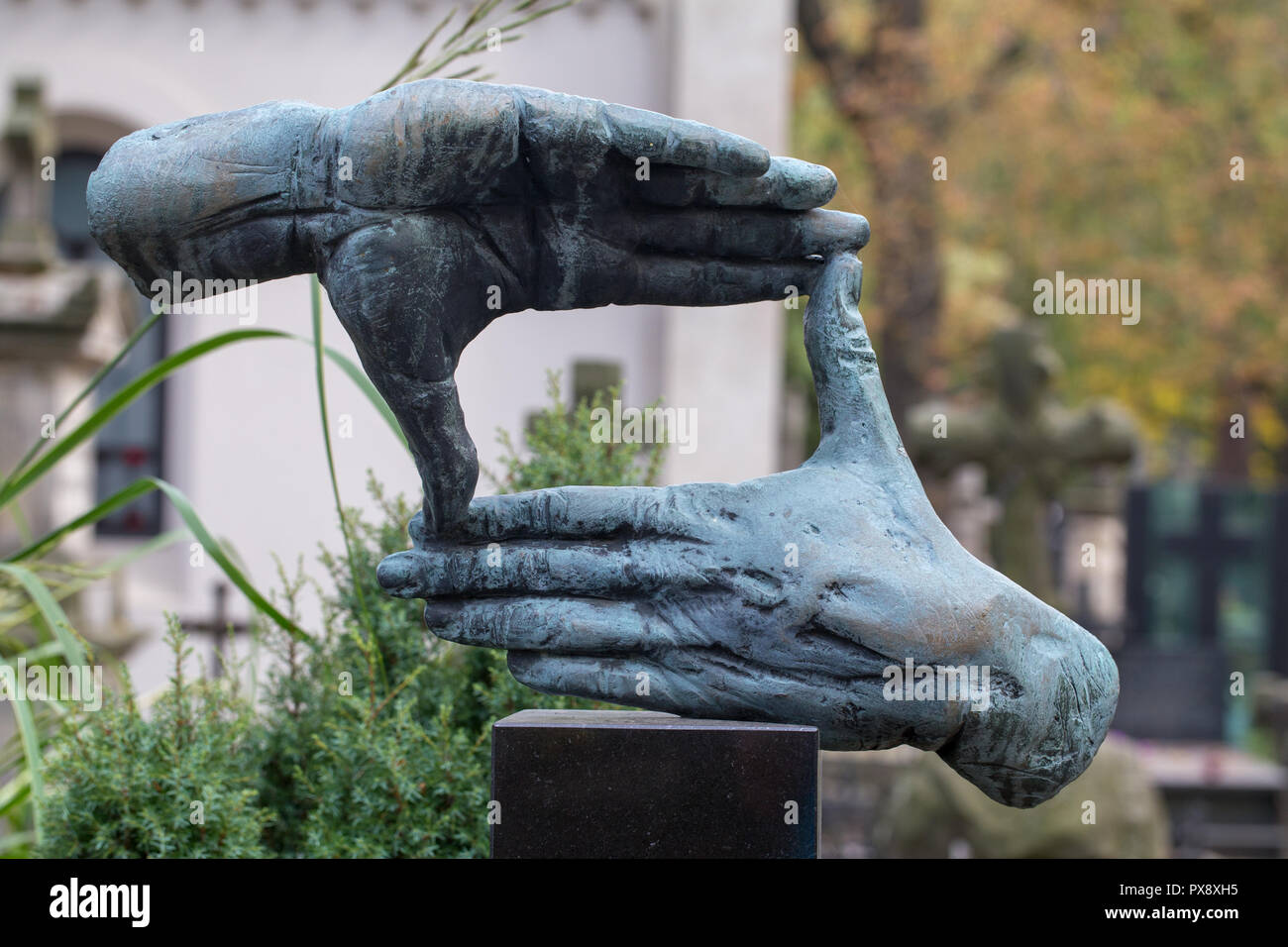 Hands shaped sculpture at the grave of Polish famous film director  Krzysztof Kieslowski at Powazki Cemetery, Warsaw, Poland Stock Photo - Alamy