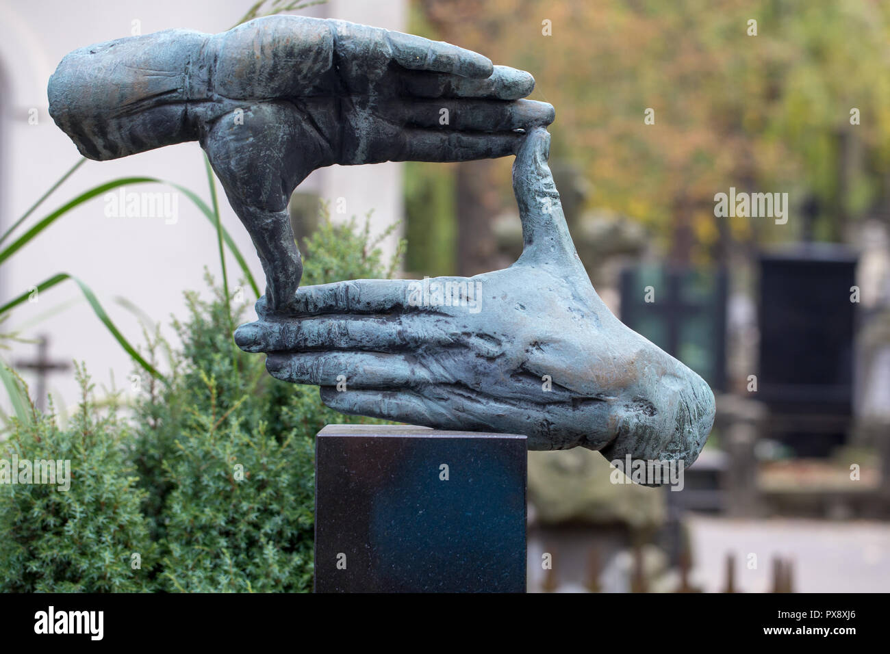 Hands shaped sculpture at the grave of Polish famous film director Krzysztof Kieslowski at Powazki Cemetery, Warsaw, Poland Stock Photo