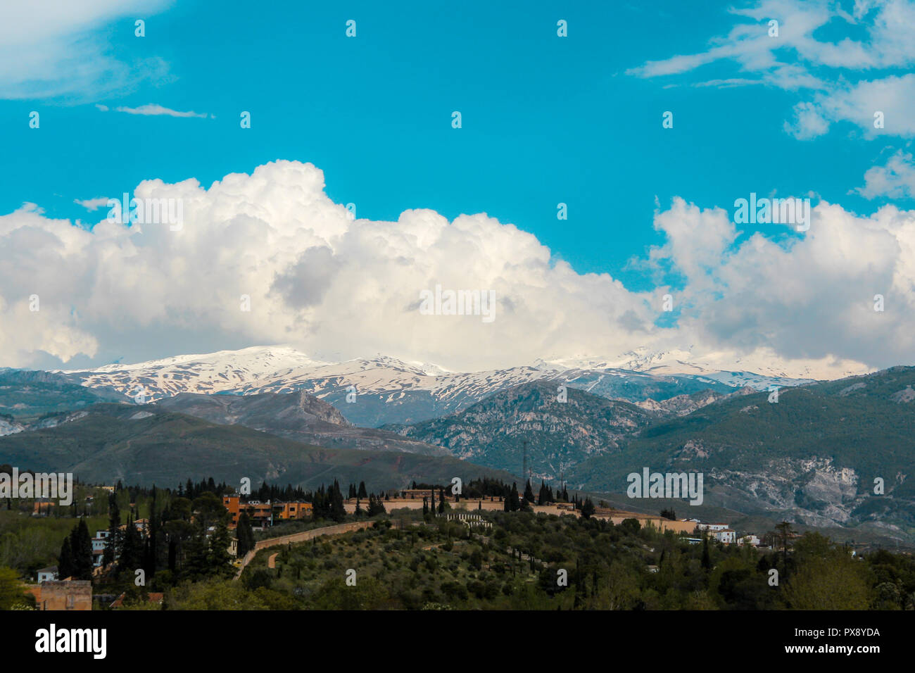 Beautiful view of snowy mountains in Sierra Nevada, Granada, Spain. Highest point of continental Spain the third highest in Europe. popular tourist de Stock Photo