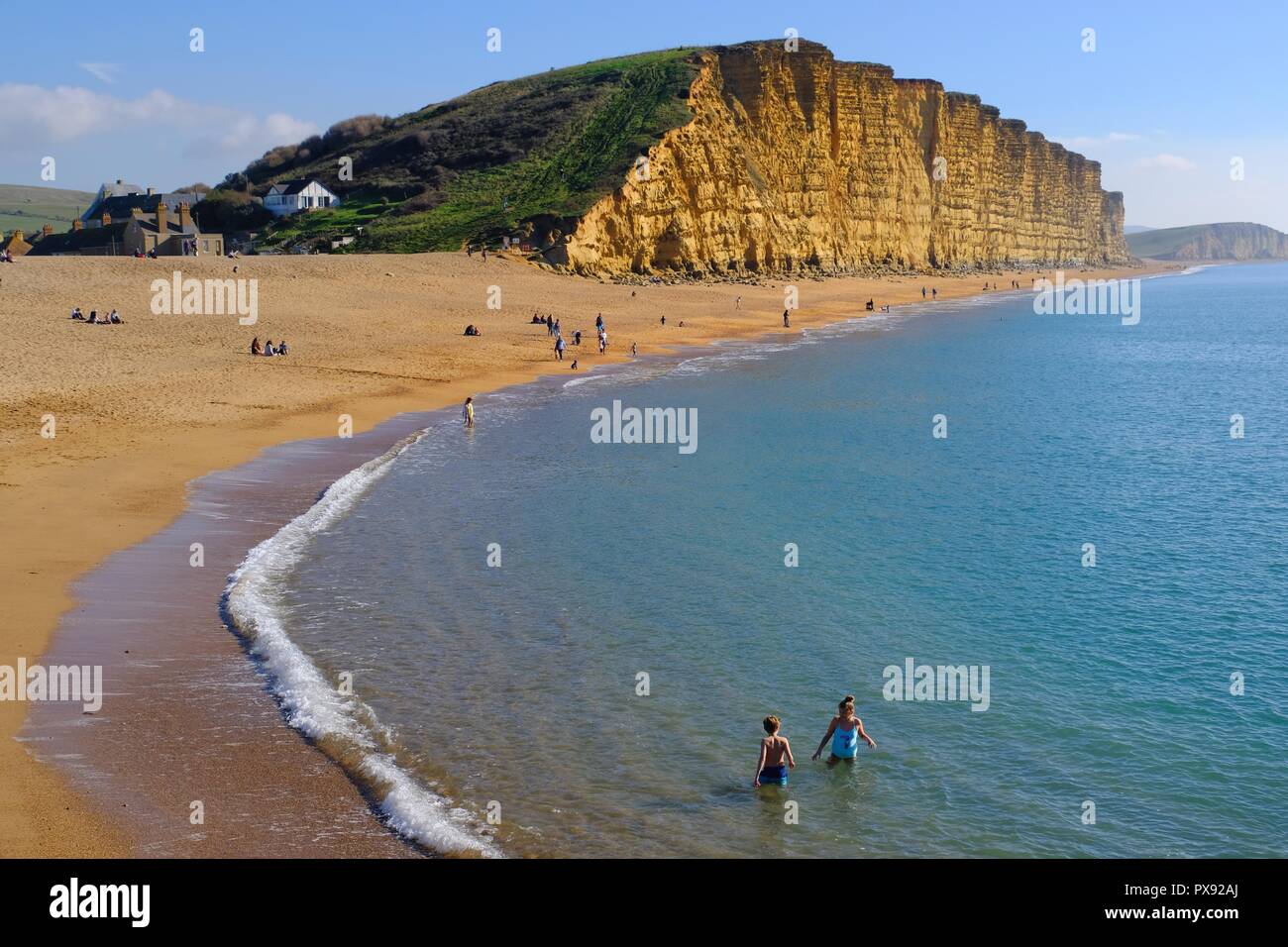 West Bay, Dorset, UK - 20 October 2018 Visitors to West Bay on the Dorset coast enjoy what promises to be the last of the sunshine before the cold weather sets in. Credit: Tom Corban/Alamy Live News Stock Photo