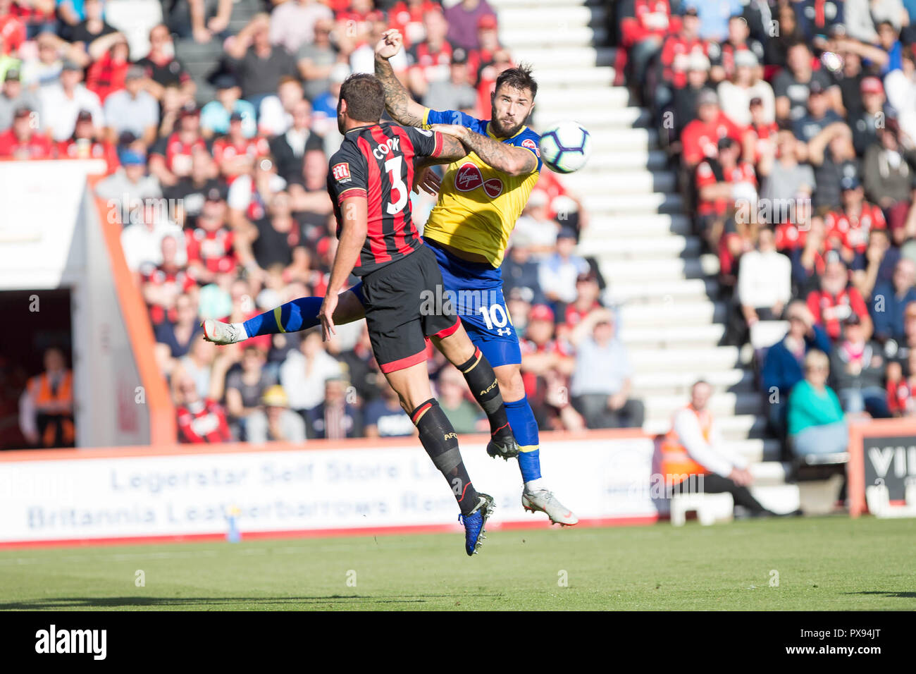 Bournemouth, UK. 20th Oct, 2018. Charlie Austin of Southampton and Steve Cook of Bournemouth challenge for the ball during the Premier League match between AFC Bournemouth and Southampton at the Vitality Stadium, Bournemouth, England on 20 October 2018. Photo by Simon Carlton.  Editorial use only, license required for commercial use. No use in betting, games or a single club/league/player publications. Credit: UK Sports Pics Ltd/Alamy Live News Stock Photo