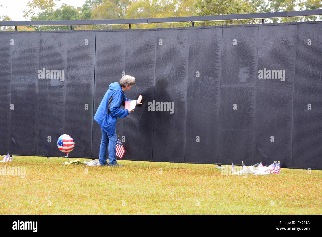 Wake Forest, North Carolina, United States. 20th Oct, 2018: The Wall That Heals, a mobile replica of the Vietnam Memorial in Washington DC, visits Wake Forest on it's cross country journey honoring veterans and to provide friends and families a way to remember servicemen who died in the conflict. Credit: D Guest Smith/Alamy Live News Stock Photo