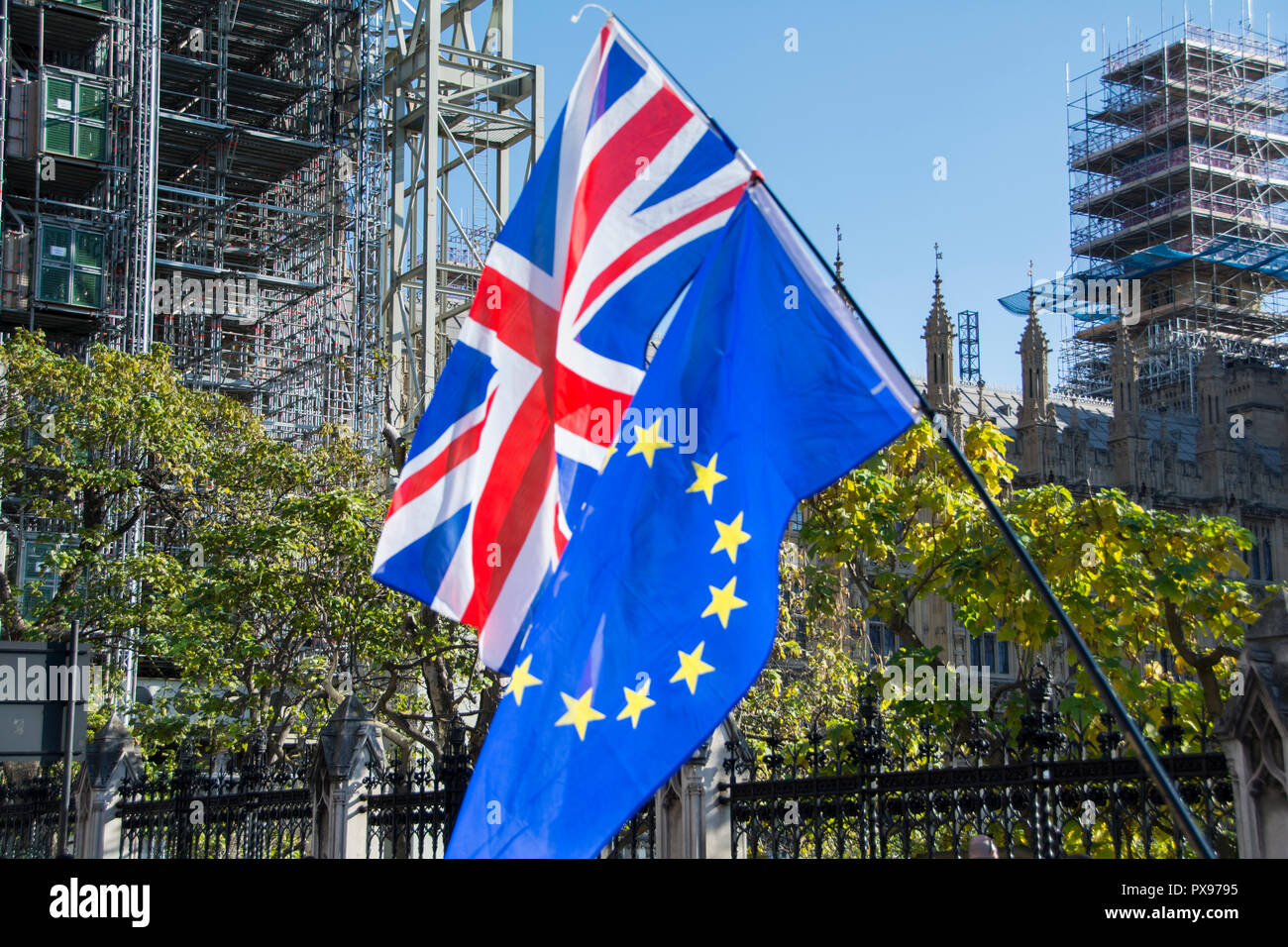 Union Jack and Flag of Europe flags side by side outside Parliament during People's March, London, UK Stock Photo