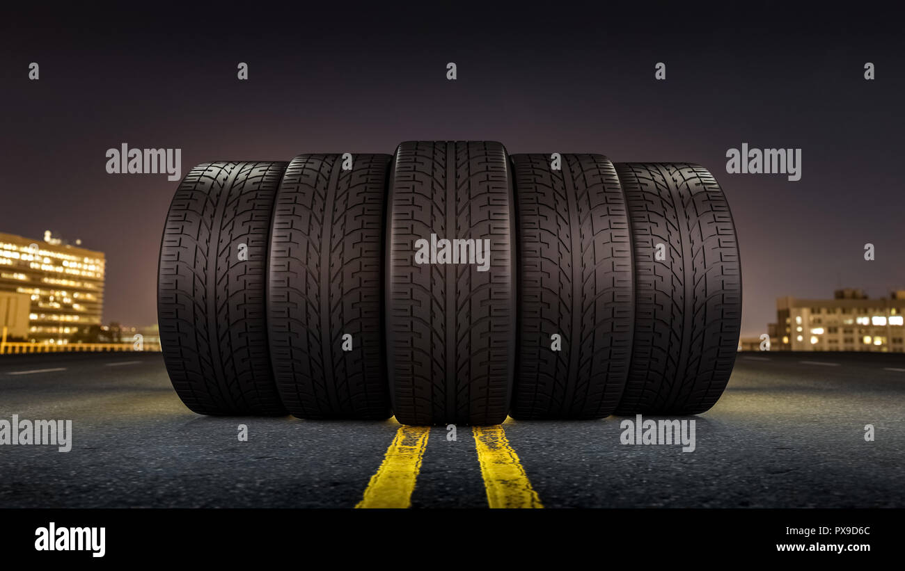 Five tires rolling on a street in a city at night Stock Photo Alamy