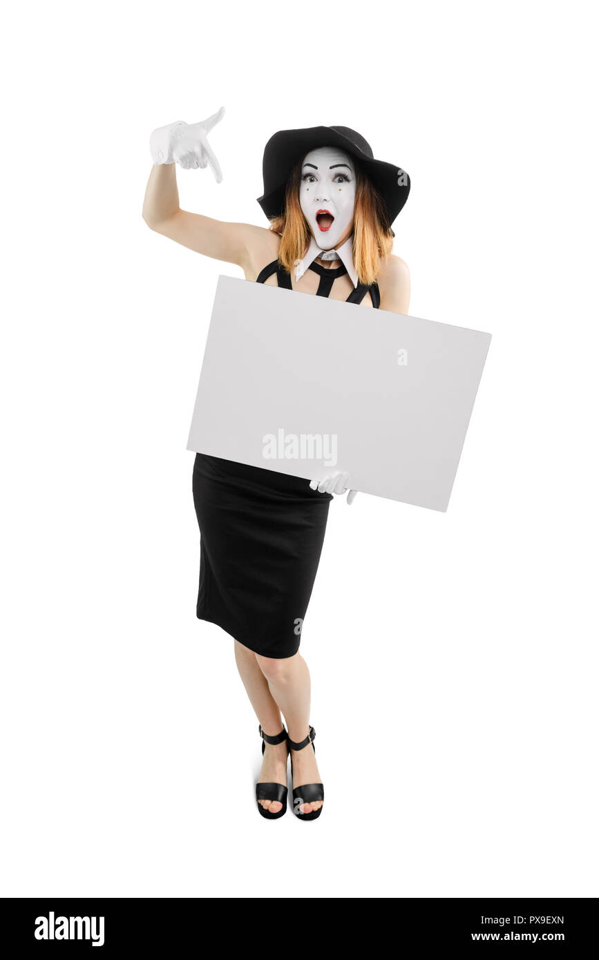 Your text here. Young woman holding a big empty card for your content. Vertical full body portrait of mime actress, isolated on white. Stock Photo