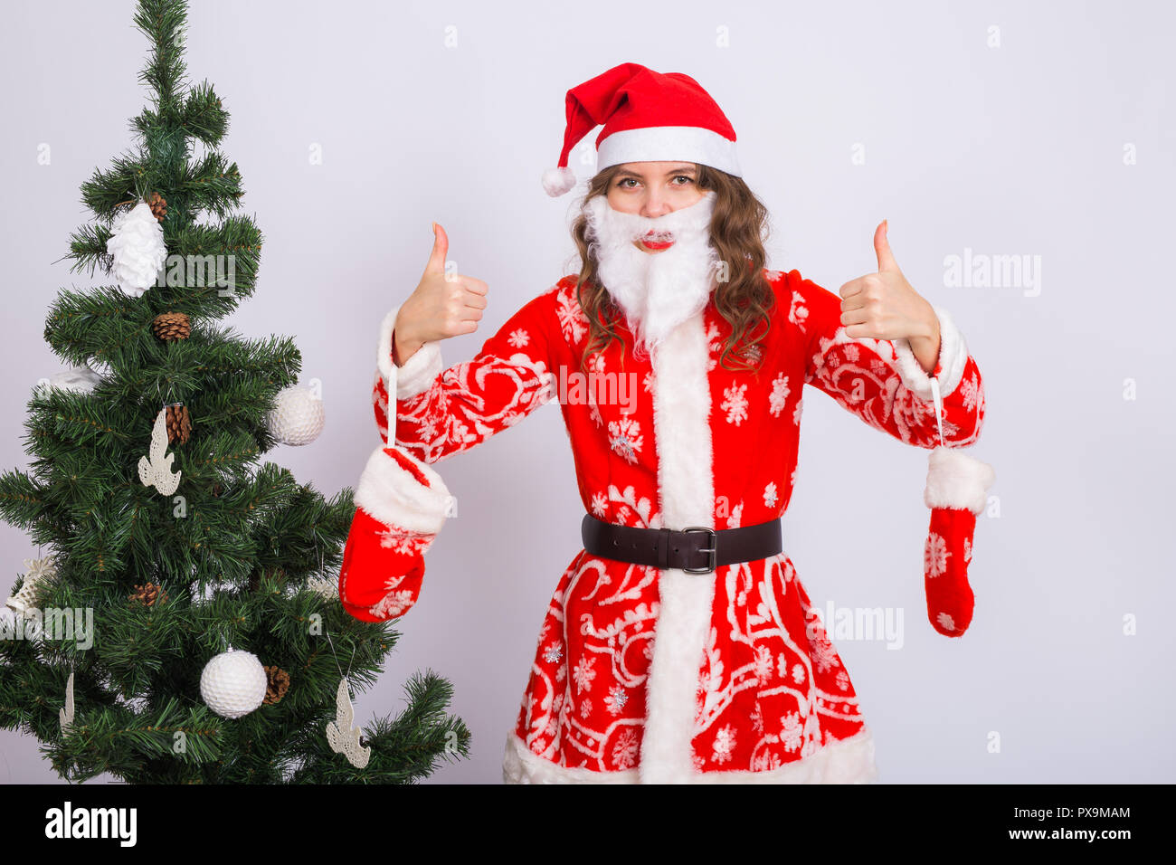 santa suit and in artificial beard 