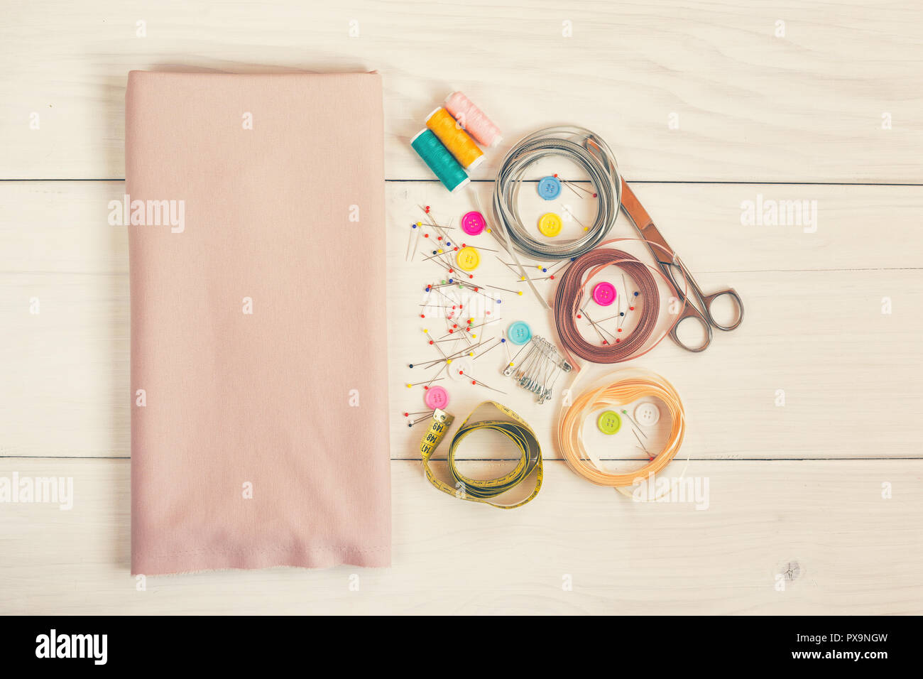 Sewing accessories on wooden table. Stock Photo