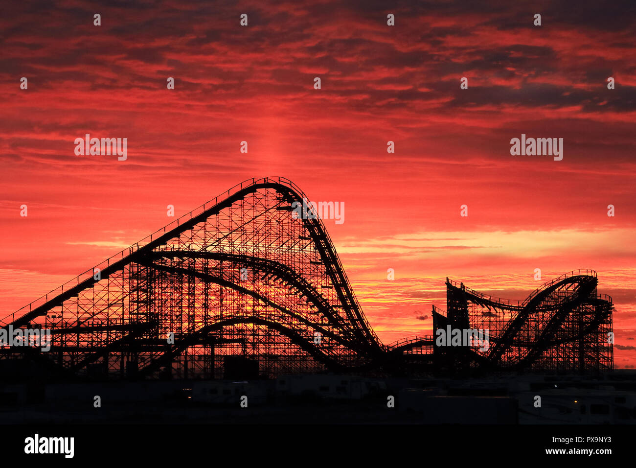 The Great White Roller Coaster at dawn on the boardwalk at Wildwood, New Jersey, USA Stock Photo