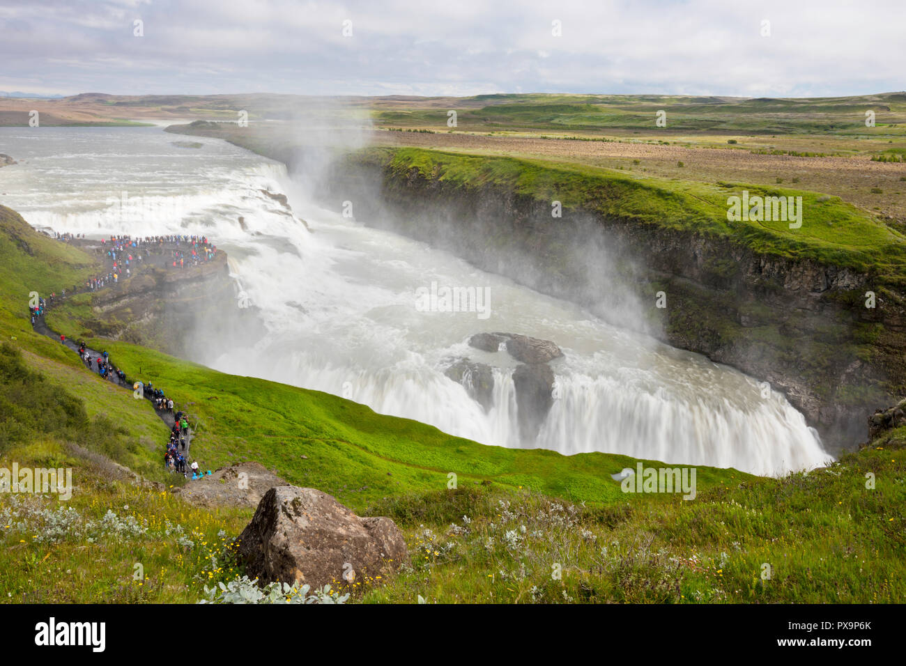 Tourists visiting iconic Gullfoss, Golden Falls, Olfusa River in southwest Iceland. Stock Photo