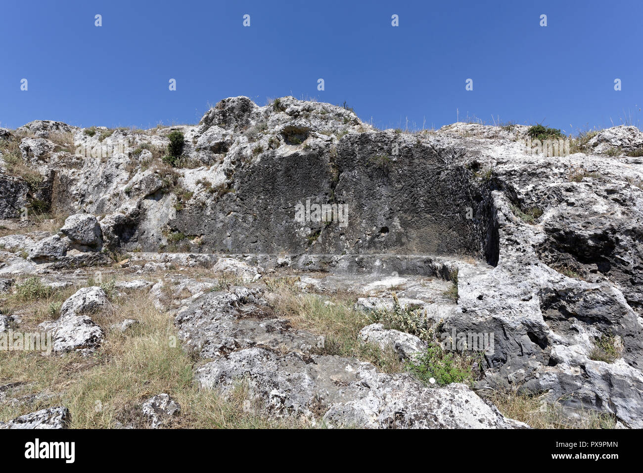 Structure cut into the east side of the Acropolis hill. Ancient Stymphalos. Stymphalia. Peloponnese. Greece. Stock Photo