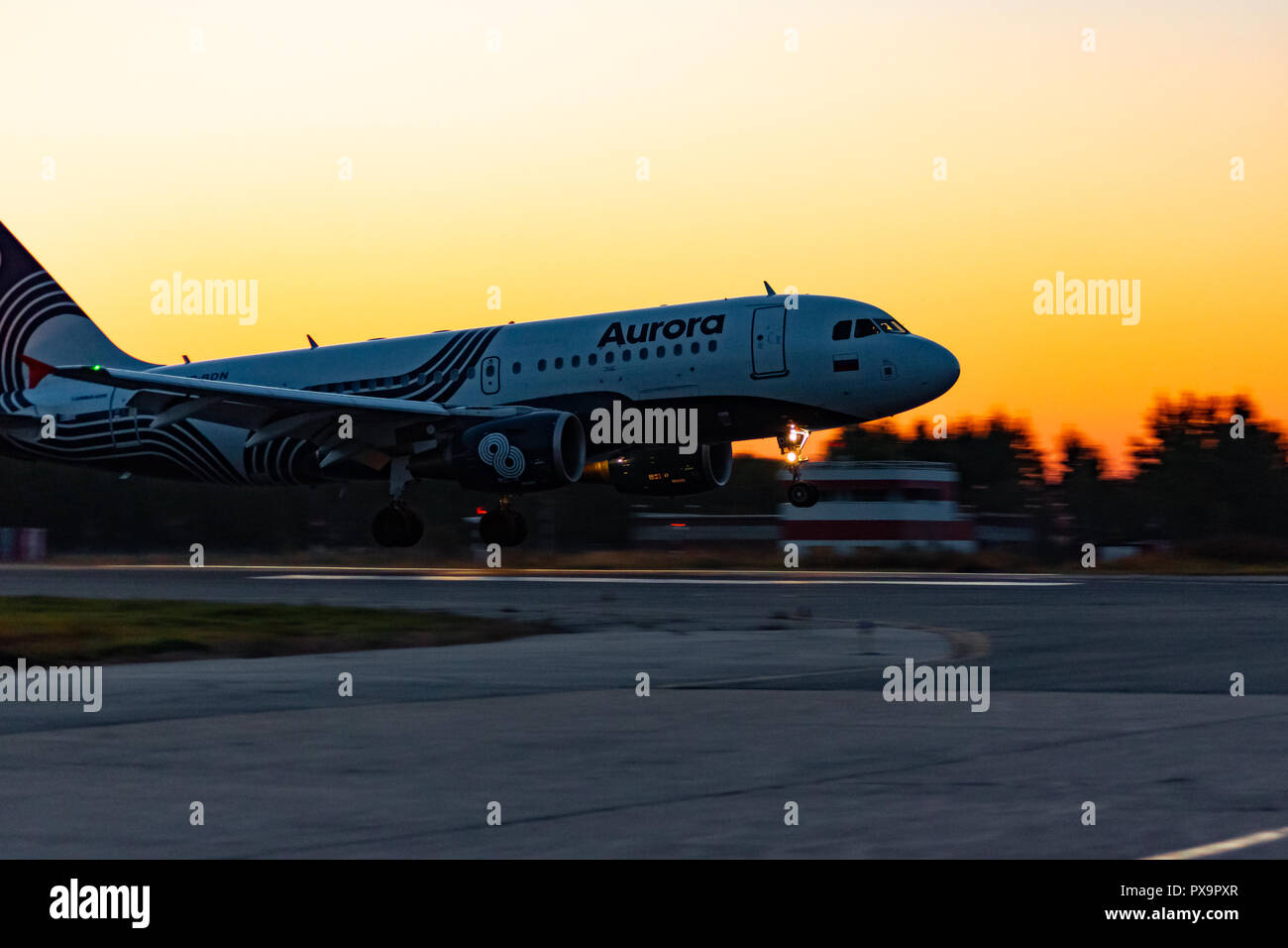 KHABAROVSK, RUSSIA - SEP 29, 2018: Aircraft Airbus A319-111 VP-BBN Aurora airline lands at the airport of Khabarovsk. Stock Photo