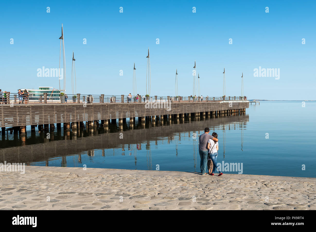 Azerbaijan, Baku, May 15, 2018. A happy family near pier in National Seaside Park Stock Photo