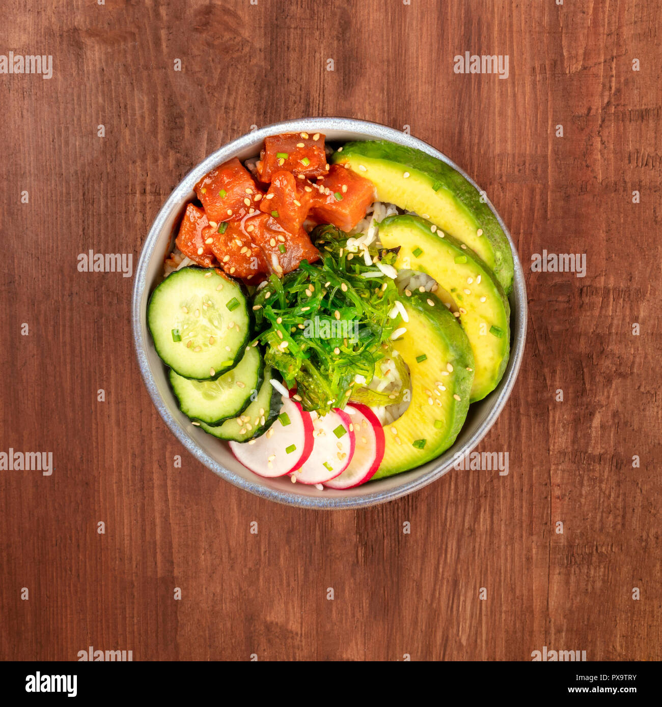 Hawaiian tuna poke salad with wakame, vegetables, and copy space Stock Photo