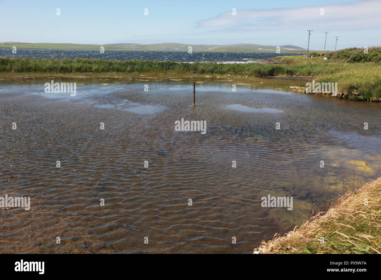 The Loch of Stenness, Orkney, looking towards Hoy, seen from the Bridge of  Brodgar Stock Photo - Alamy