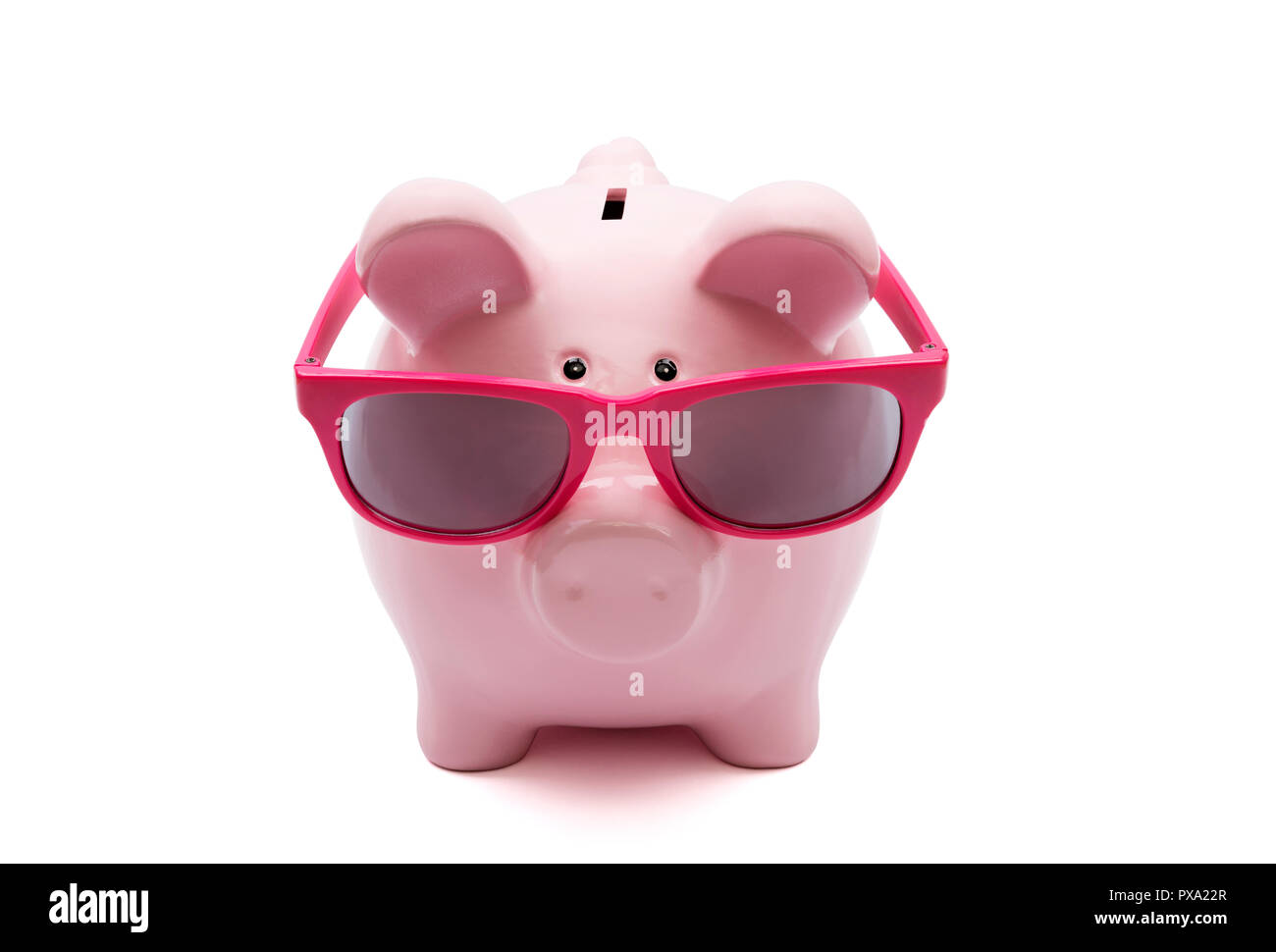 Piggy bank with pink glasses on white background Stock Photo