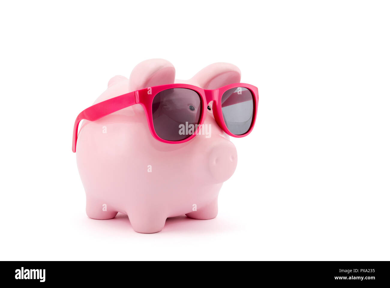 Piggy bank with pink glasses on white background Stock Photo